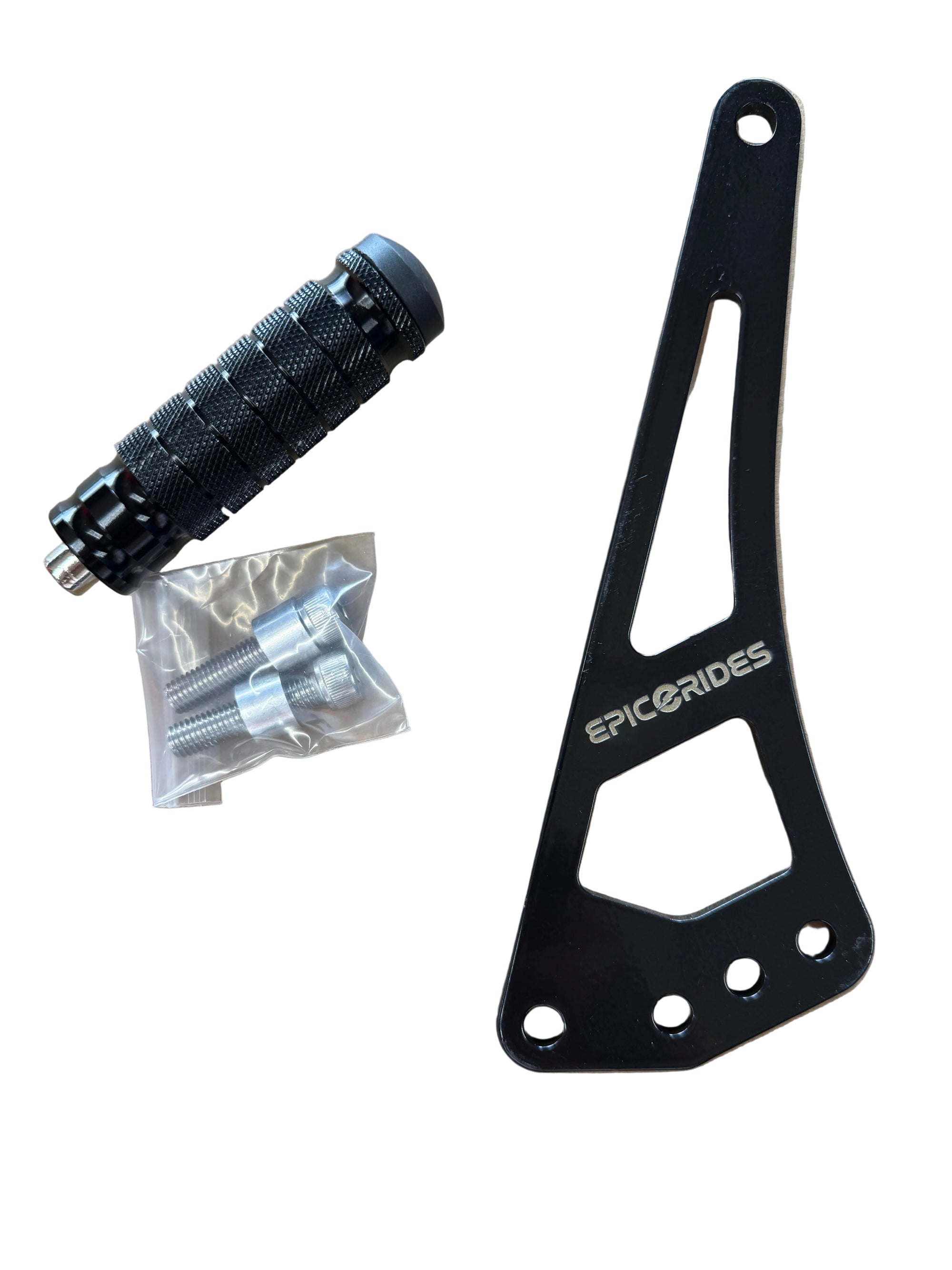 Black shift lock bracket with 'epic e rides' branding, a black foot lock, and a clear plastic bag with screws on a brown surface.