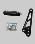 Black shift lock bracket with 'epic e rides' branding, a black foot lock, and a clear plastic bag with screws on a brown surface.